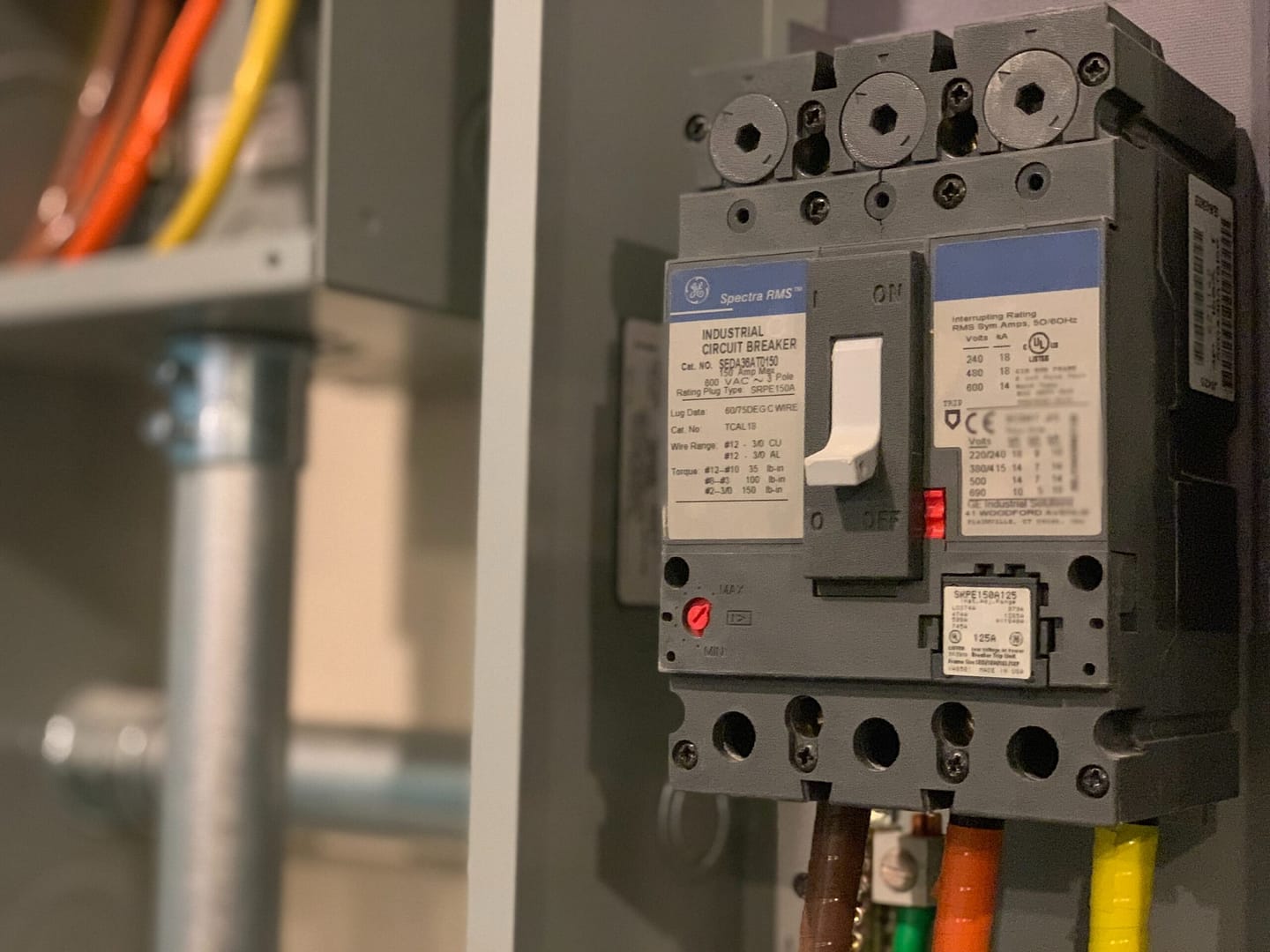 Close up of a circuit box with a switch that is common to commercial electrical installation. When your customer needs a qualified electrician, they will find out online through local search and your listing in LocalSplash.