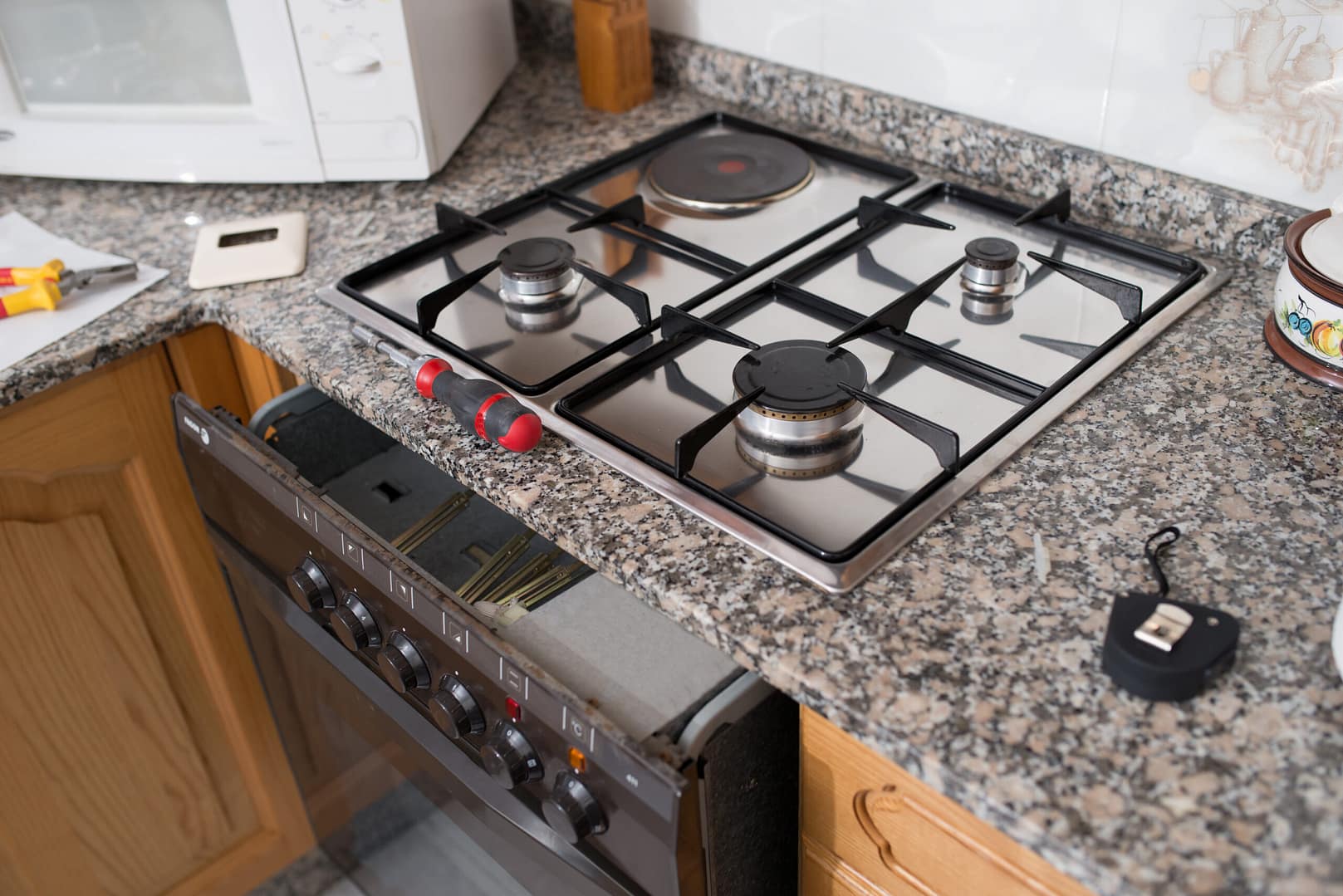 Modern oven range in a sleek kitchen, illustrating the demand for household appliance repair services.