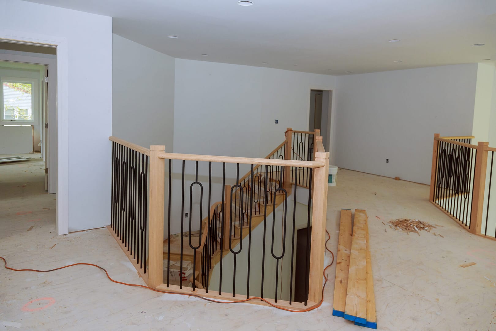 Assembly and installation of wooden railings in a newly constructed house.