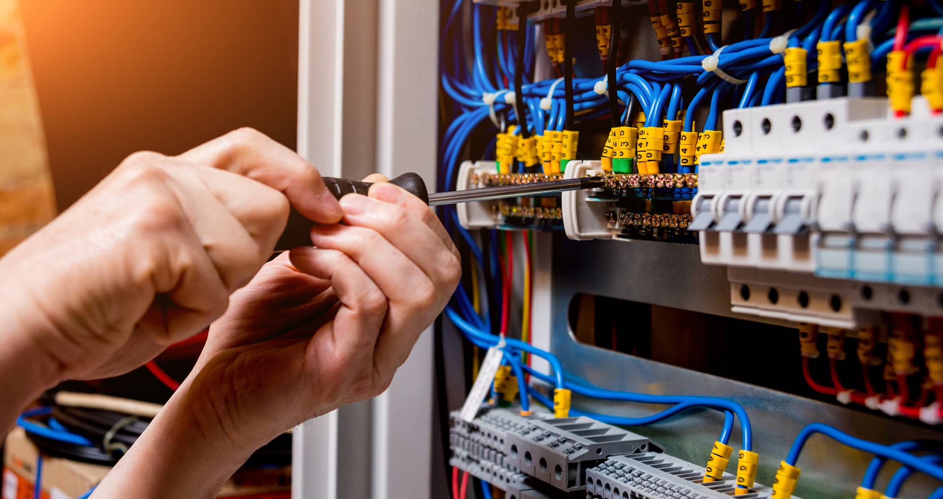 Close up of an electrician working on wiring. While you are responding to service calls, your online listing is working 24/7 to secure more customers for your business.