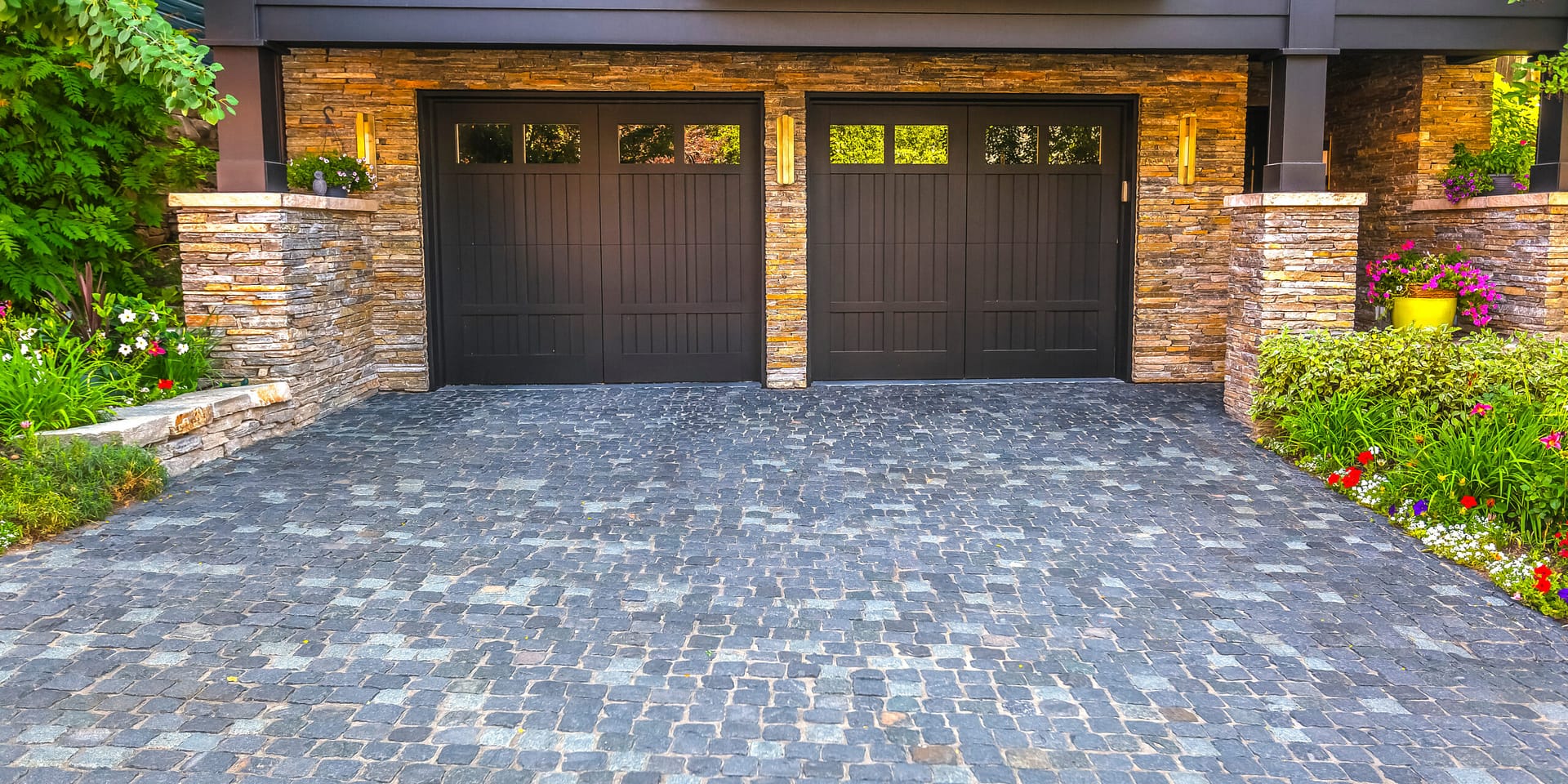 View of a two-door garage installation showing the property’s attractive hardscape. Partner with Local Splash to drive more clients to your garage door business.