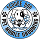 a blue and white logo for a dog grooming business