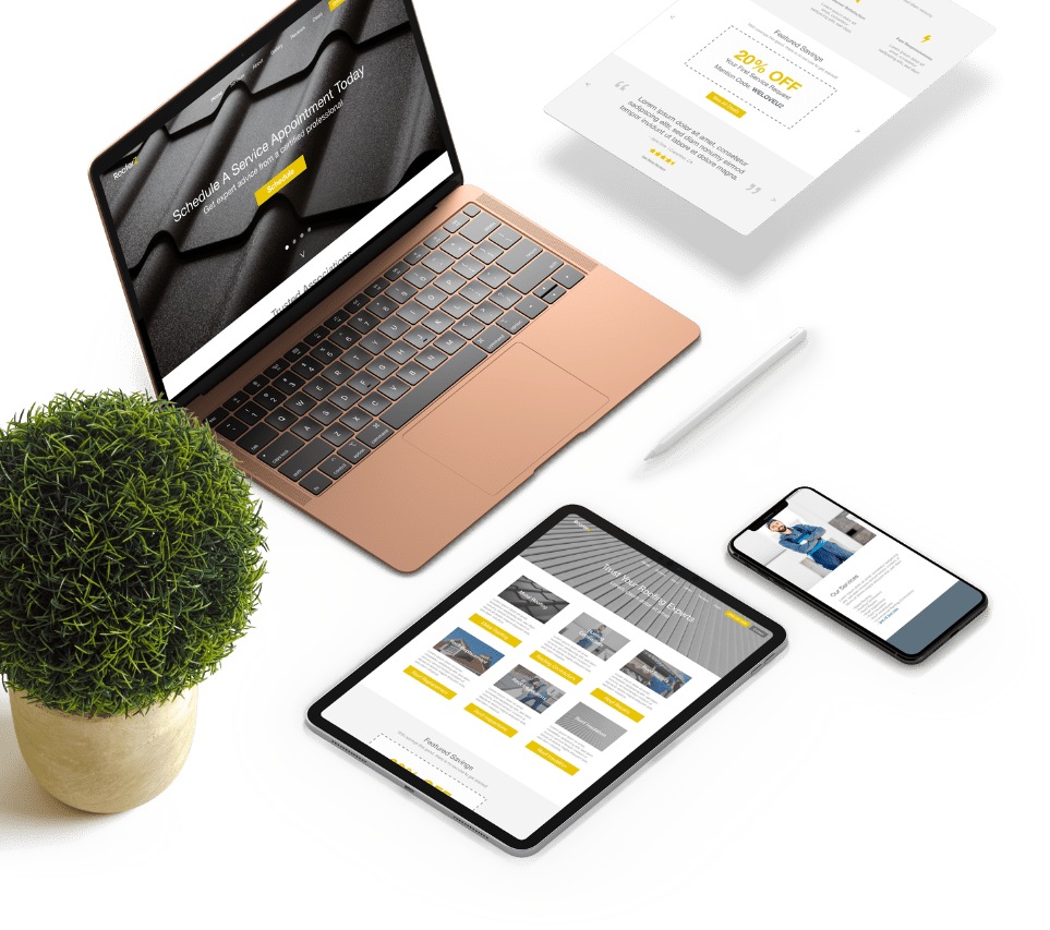 A laptop, tablet, phone, and tabletop on a table