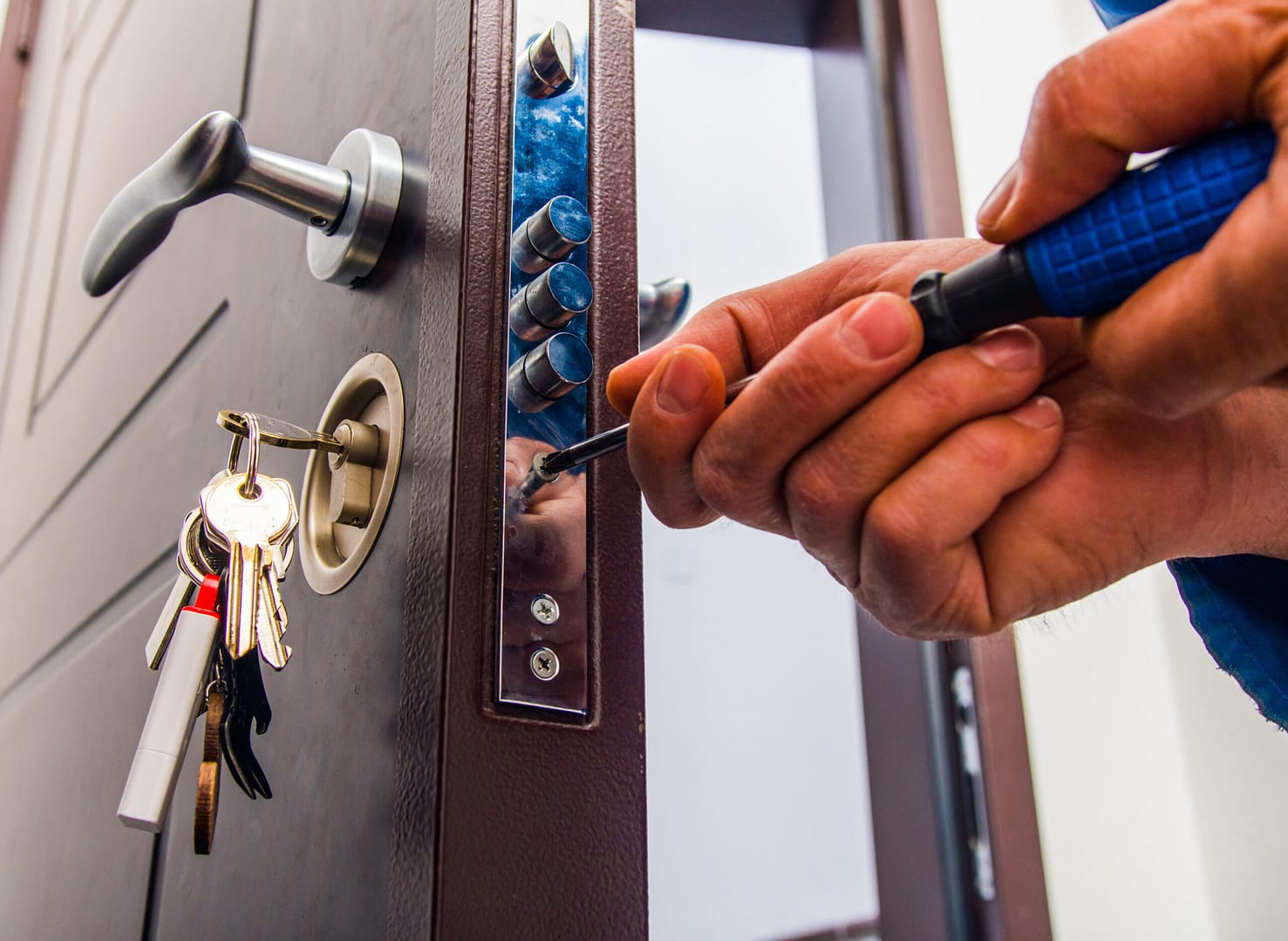 Locksmith installs a deadbolt to enhance security - essential marketing can boost service visibility