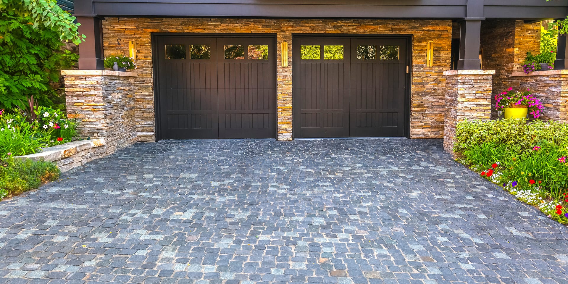 View of a two-door garage installation showing the property’s attractive hardscape. Partner with local splash to drive more clients to your garage door business.