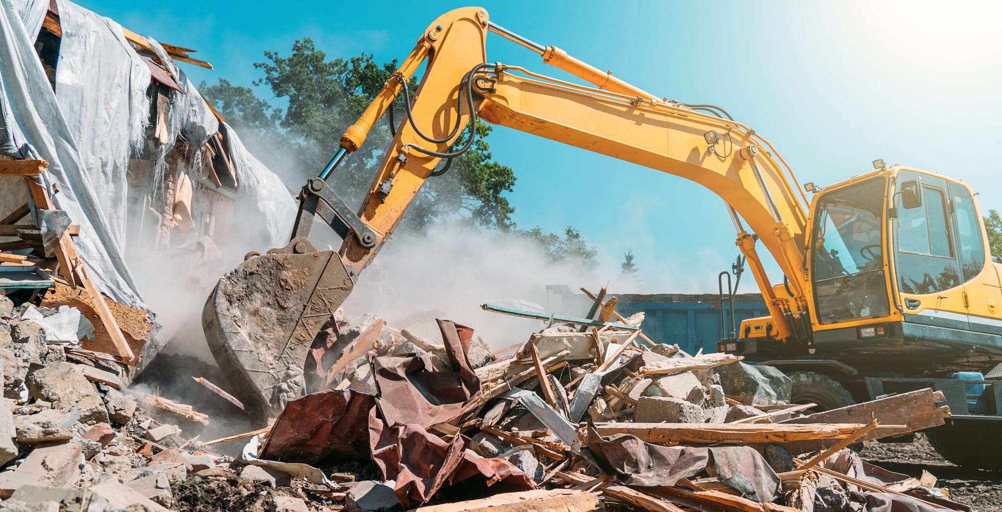 Excavator in action, moving construction debris, emphasizing the need for specialized excavation contractor marketing.