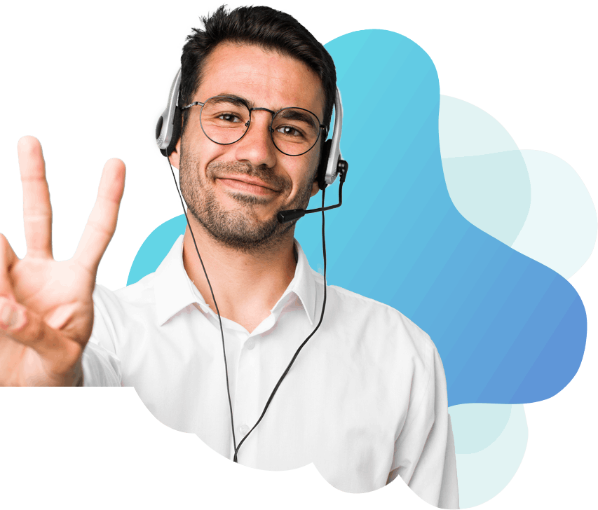 A smiling man wearing headphones making a peace sign.